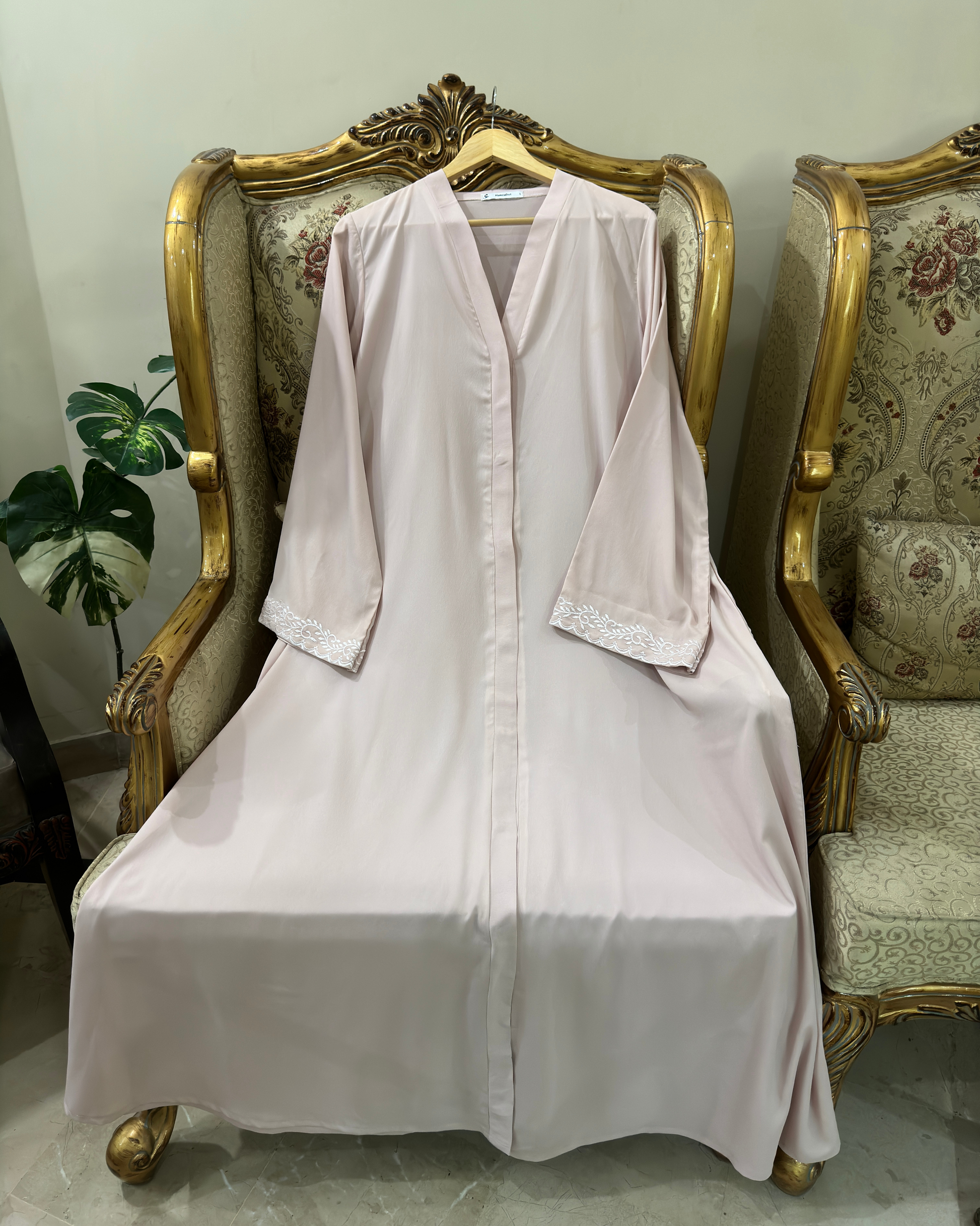 Muslim woman wearing light pink abaya with pearl-colored embroidery - breathable modest Islamic dress Michigan