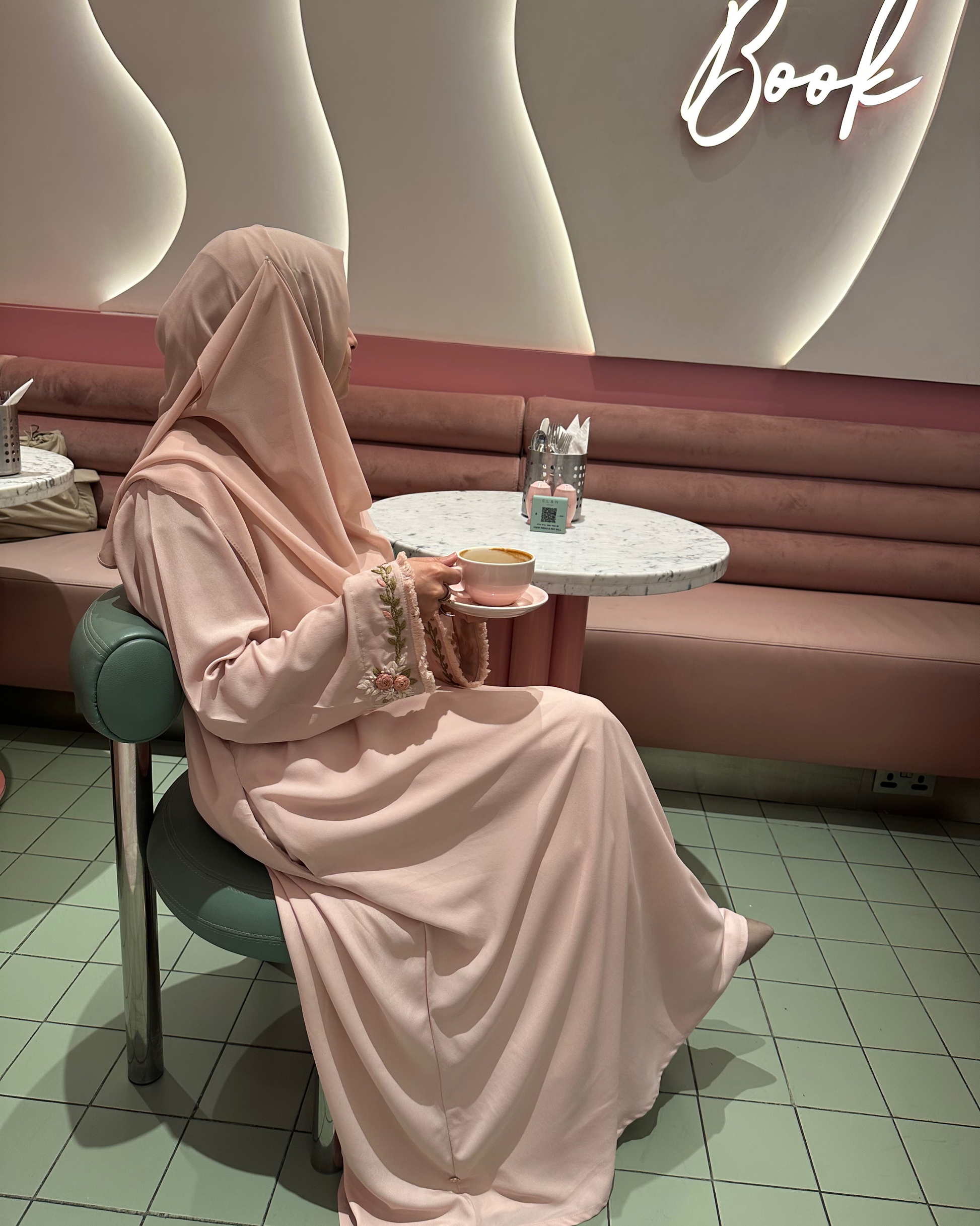 Muslim woman wearing light pink hand embroidered abaya with pockets - everyday modest wear USA
