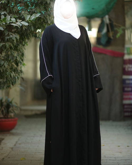 Close-up of white piping detail on lightweight abaya sleeves - timeless modest Islamic dress Michigan