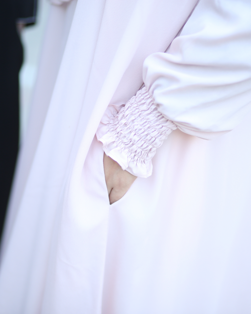 Muslim woman wearing light pink abaya dress - lightweight breathable modest Islamic clothing Michigan
