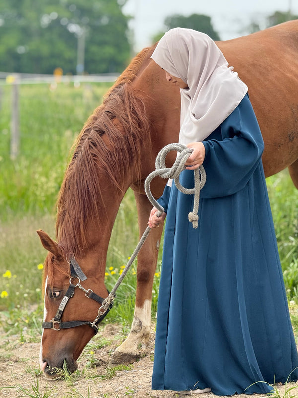 Muslim woman in Ocean Velvet Abaya - luxurious teal Korean Nida modest dress USA & Canada