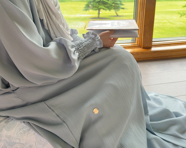 Muslim woman in modest Frozen Abaya - premium crinkle fabric modest wear inspired by quiet strength
